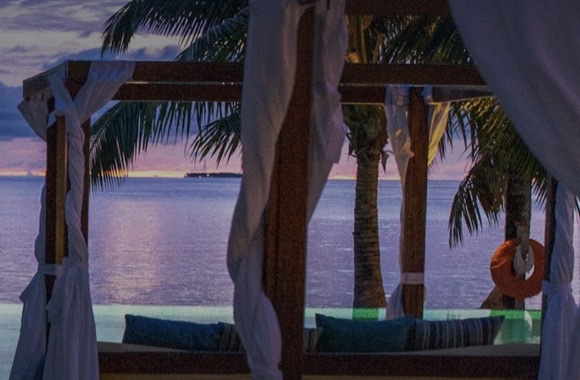 Villa Serena, seafront on the Costa de Cádiz: infinity pool and cabanas at sunset